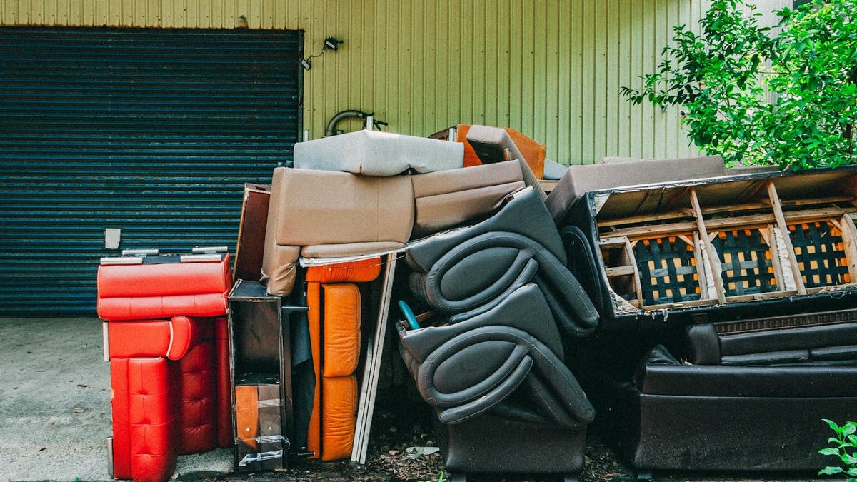 Furniture piled on a driveway